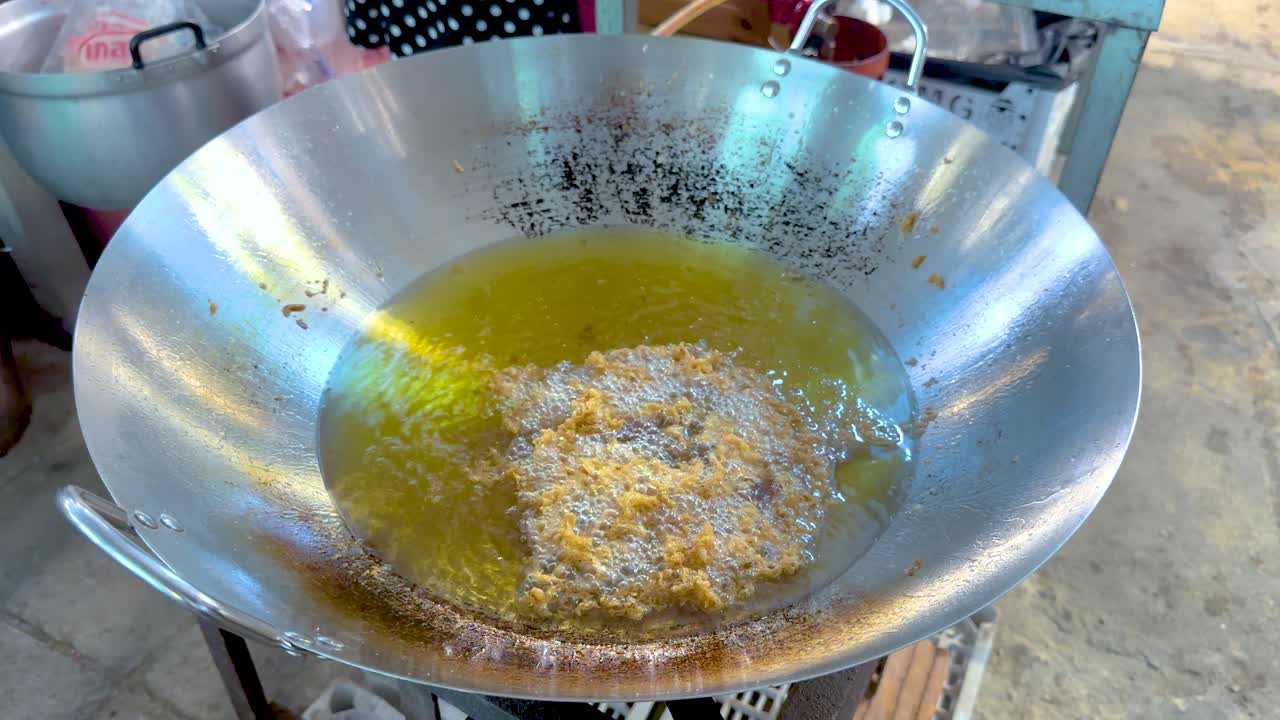 Cooking process in a large frying pan