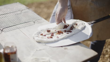 making a pizza outdoors