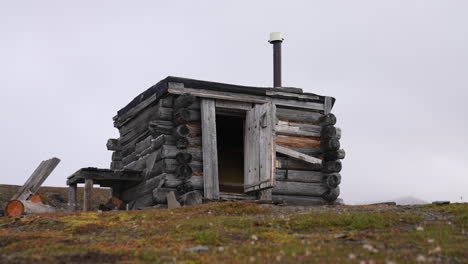 Wooden-Fishing-and-Hunting-Hut-on-Coastline-of-Greenland-in-Summer-Season