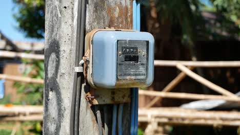 close up footage of electricty meter in rural villlge, thailand