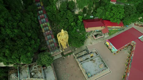 aerial view of golden statue at batu caves entrance, kuala lumpur