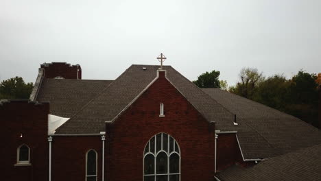 Closeup-footage-of-famous-church-showing-Cross-of-Jesus-Christ-featuring-trees-in-the-back