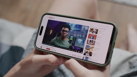 person watching video tutorial on smartphone