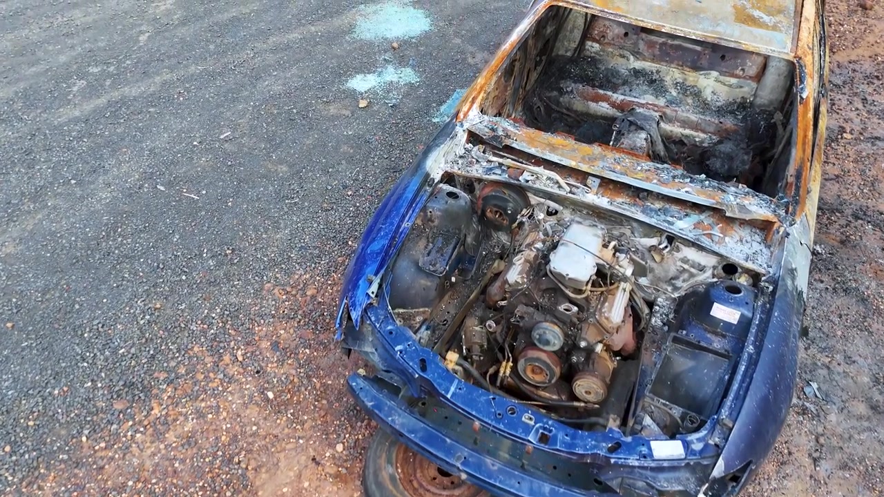 Aerial View of a Burnt-Out Wrecked Car