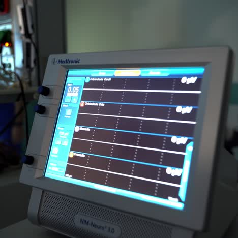 approaching to the screen of the medical equipment. monitor showing the vital indexes of a patient. close up