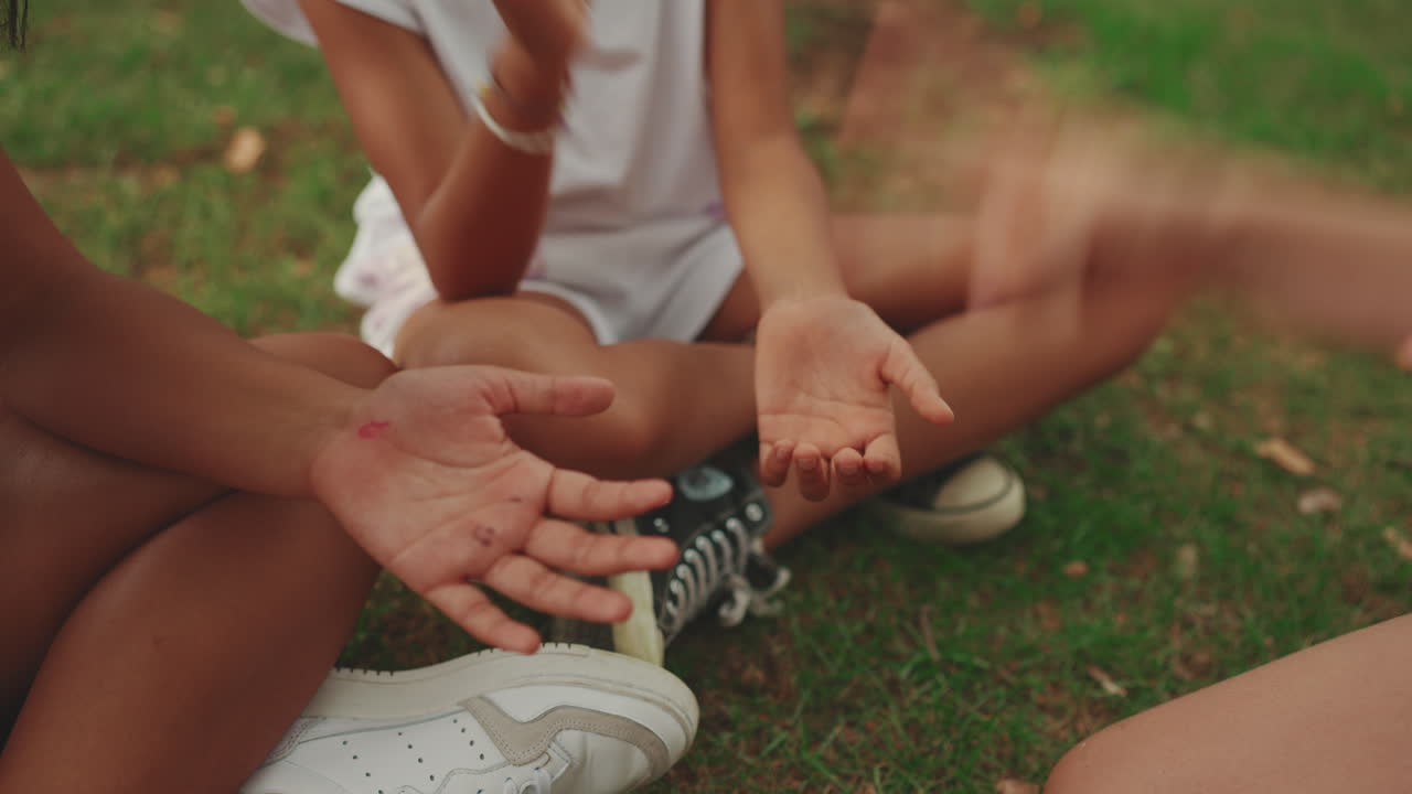 Children Playing a Hand Game Outdoors