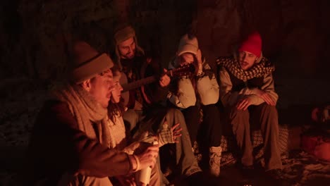 friends enjoying a night by the campfire
