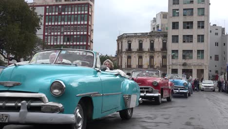 classic old cars are driven through the colorful streets of havana cuba 8