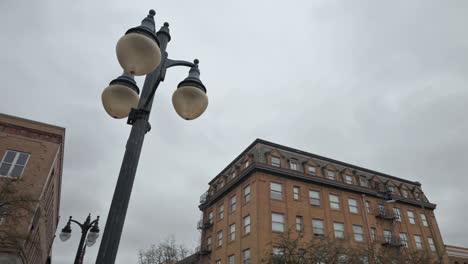 old buildings and street lamp in coos bay, oregon, panning shot