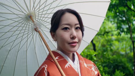 woman in kimono with umbrella