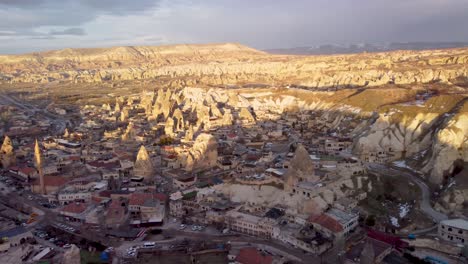 aerial drone view of goreme, turkey: scenic town nestled in the heart of cappadocia's unique rock formations - fairy chimneys: downtown of göreme, nevşehir türkiye