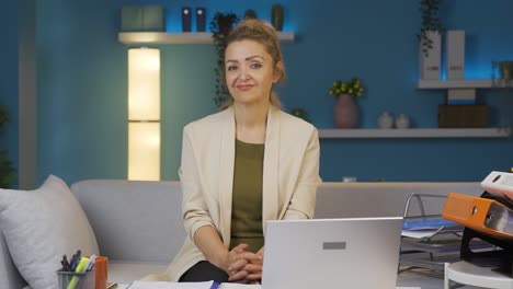 home office worker woman looking smugly at camera.