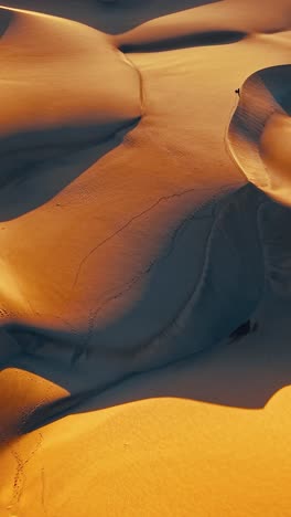 breathtaking aerial view of gran canaria's unique sand dunes at sunset