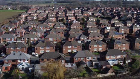 Suburban-Neighbourhood-Wales-residential-homes-rooftops-real-estate-property-aerial-low-orbit-left-view