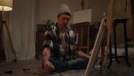 man painting at home