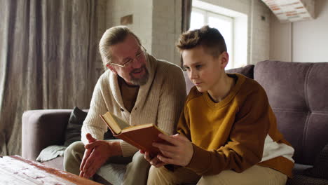 caucasian man and boy in the living room