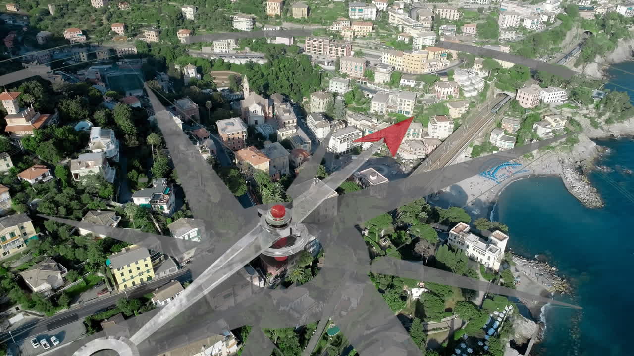 도시 건물과 바다 위의 나침반.