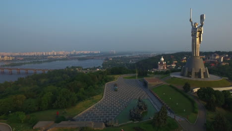 monument mother motherland on kyiv city landscape. aerial view eternal flame