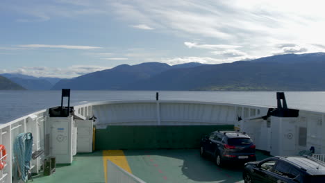 pan of a fjord in norway from on board a ferry on a beautiful sunny day