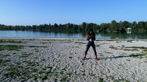 drone shot of young attractive black female doing sports outdoors