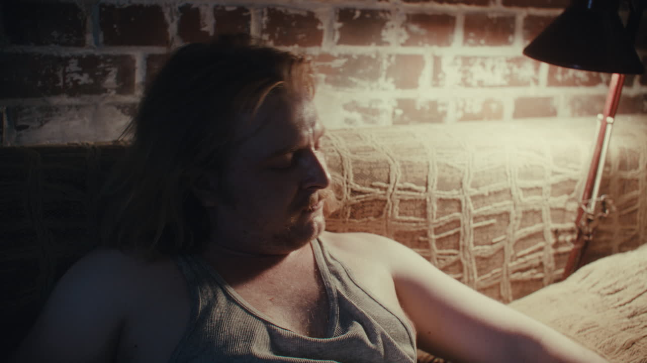 Man in distress on couch