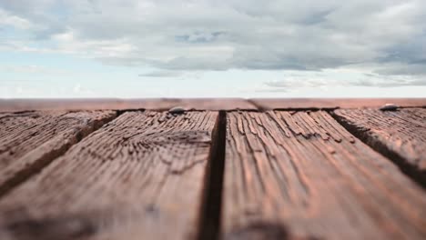 wooden deck with a view of cloudy skies