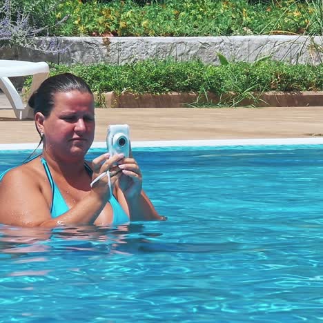 portrait of young woman taking portrait in swimming pool on tropical beach.