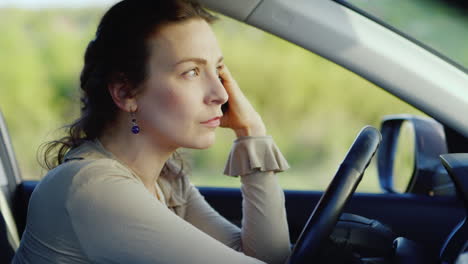 portrait of caucasian woman crying in car 2