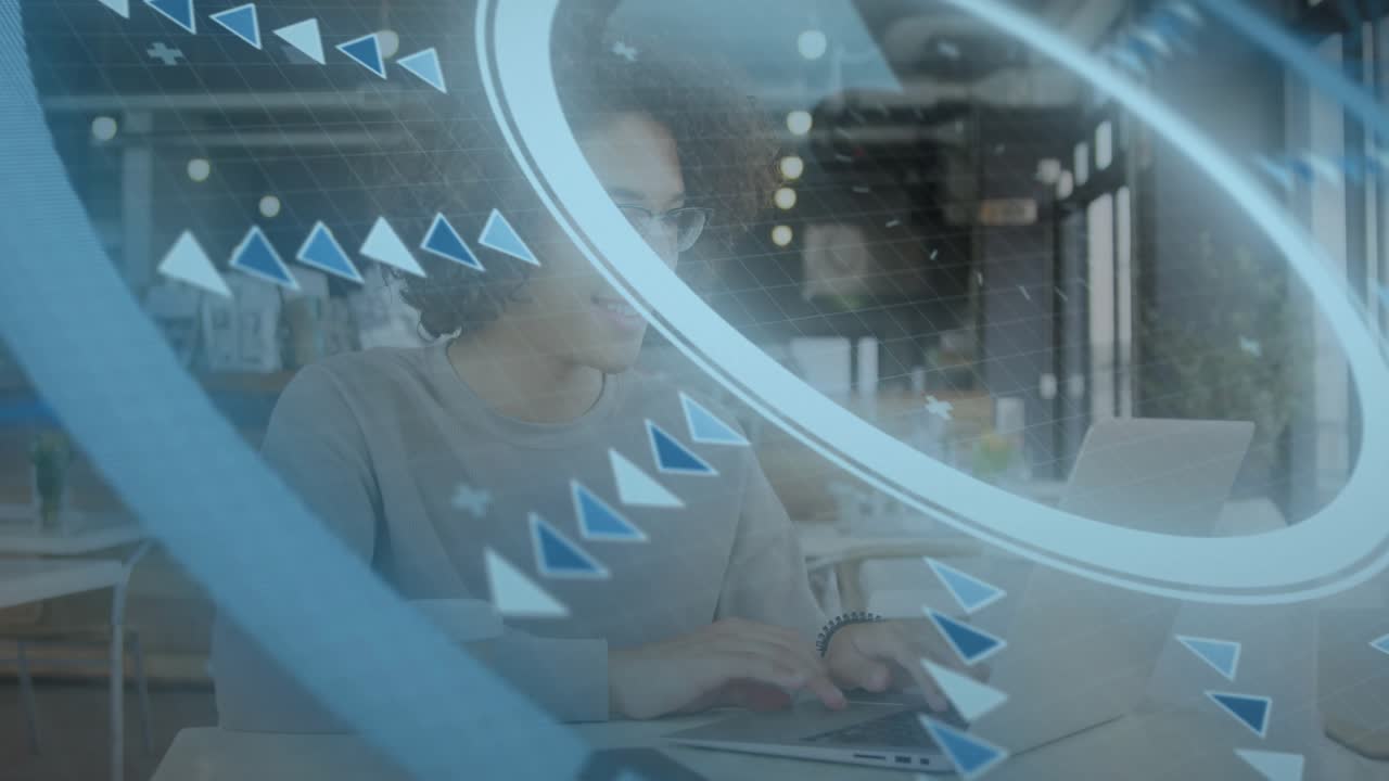 Man typing laptop in cafe, causing rotating blue overlay arrows marking phone and editing tech doc