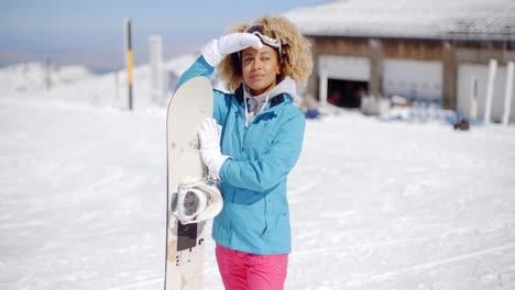 attractive young woman posing at a ski resort