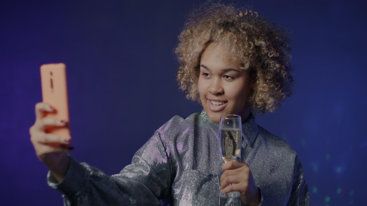 Woman Celebrating with Champagne and Selfie