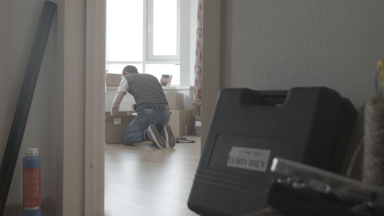 Man Packing Boxes During a Move
