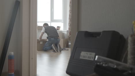 man packing boxes during a move