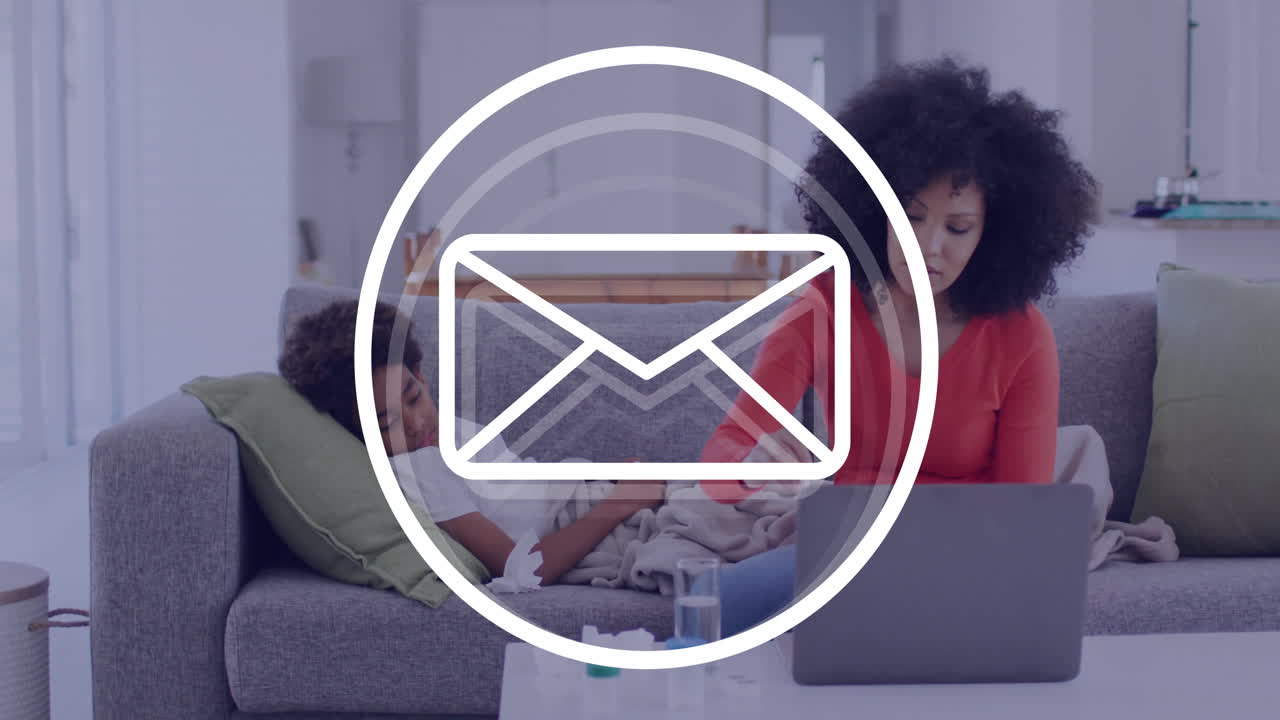 Working on laptop, woman at home with animation of email icon overlay