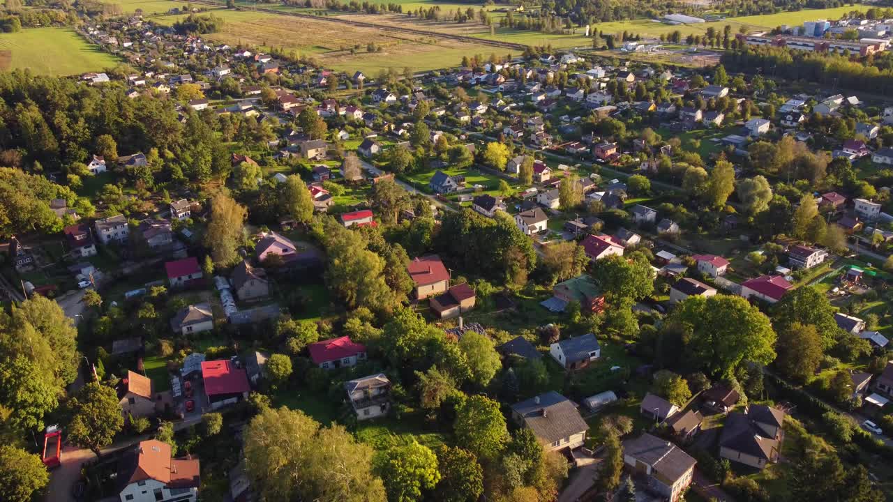 Aerial view of Ogre, Latvia, showcasing residential areas and green landscapes