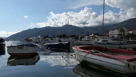 Fishing-boats-in-marina-at-seaside-promenade,-Tivat,-Montenegro