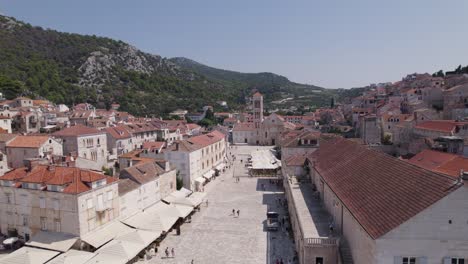 Croatia-Aerial:-Hvar-port,-Pjaca-square,-and-St