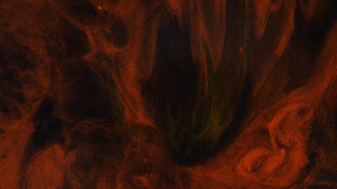 flujo de colores rojos y dorados en un fondo negro tridimensional en movimiento, transición.