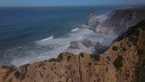 ursa beach revealed through the amazing cliffs