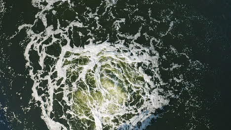 Aerial-slow-motion-vertical-view-bubbles-of-water-in-a-treatment-basin