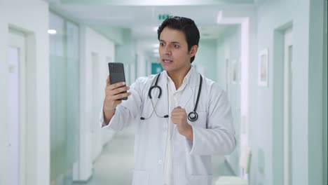 angry indian doctor shouting on video call