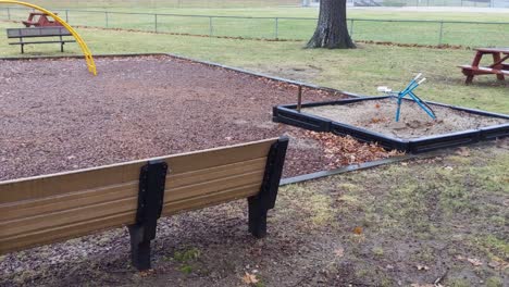 deserted playground pan empty and lonely on a rainy and dreary day