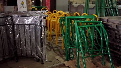 metal construction parts. colorful equipment for fence inside the warehouse. disassembled parts of fence.