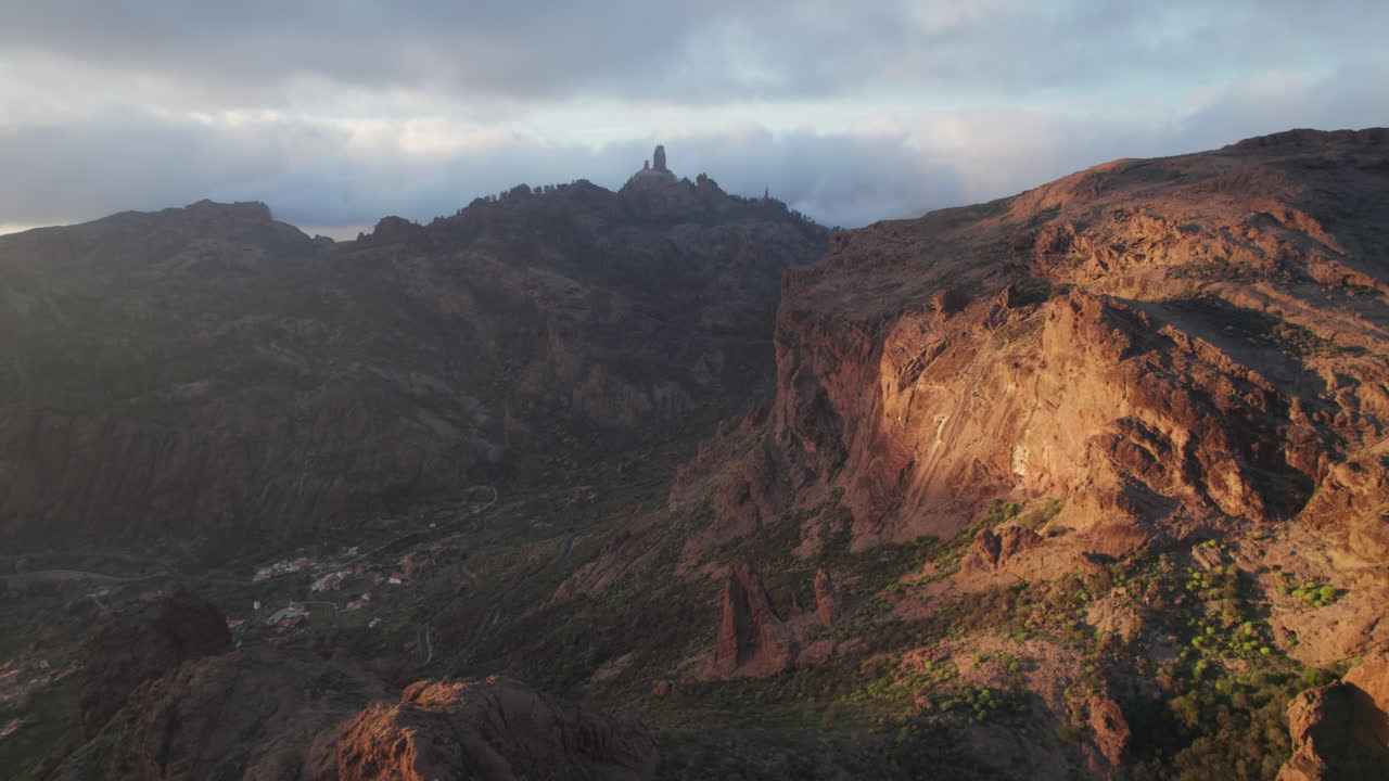Roque Nublo emerging from the clouds at sunset in Gran Canaria