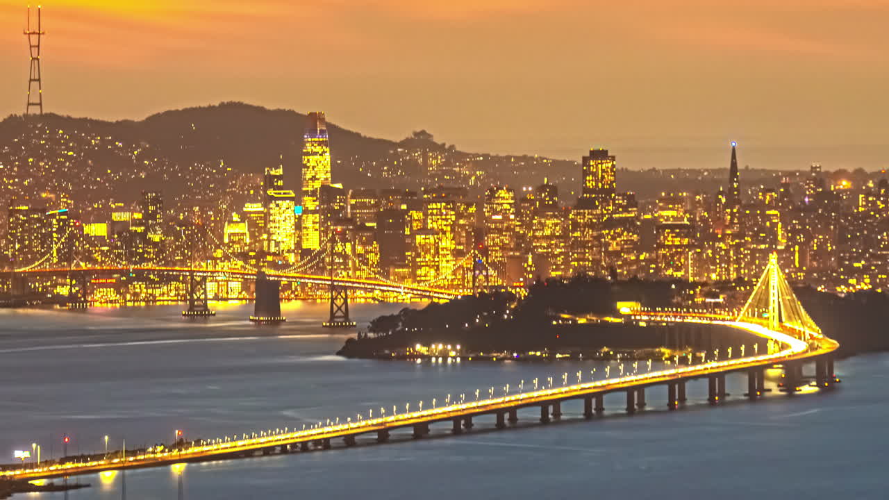Sunset to night time timelapse of San Francisco – Oakland Bay Bridge and Yerba Buena Island