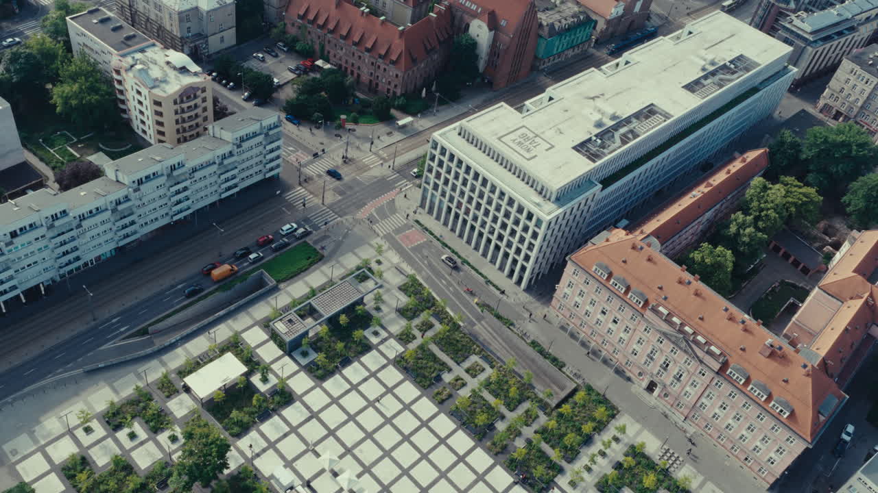 Aerial View of City Intersection and Modern Building in Wrocław, Poland
