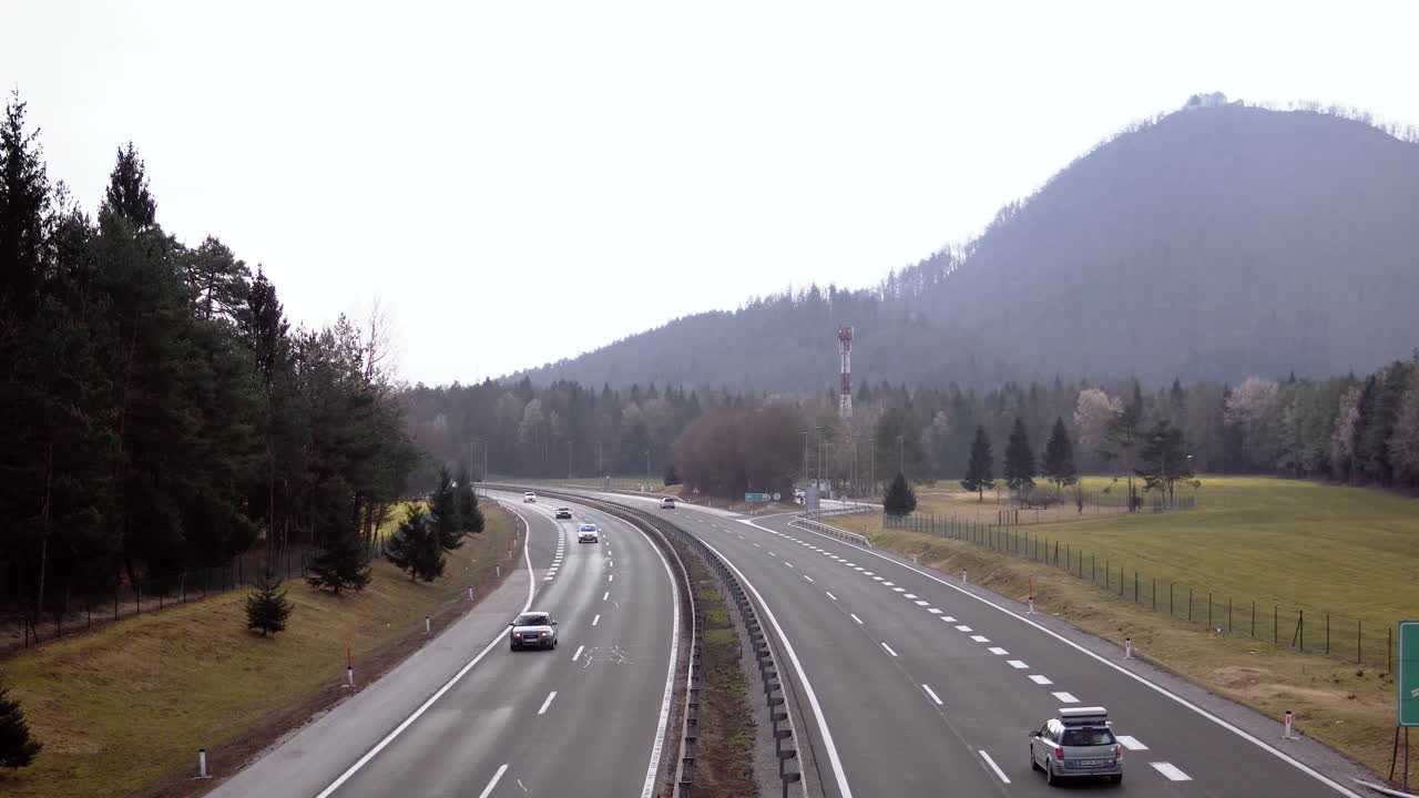 Cars passing by on a highway in nature