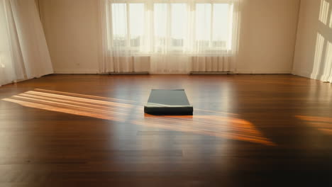 empty yoga studio bathed in sunlight
