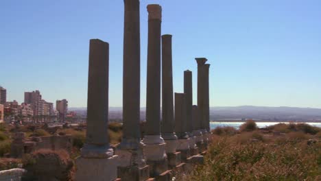 a pan across from the ancient phoenician roman ruins of tyre to the modern city in lebanon