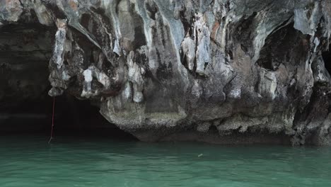 boat navigating through a serene water-filled cave